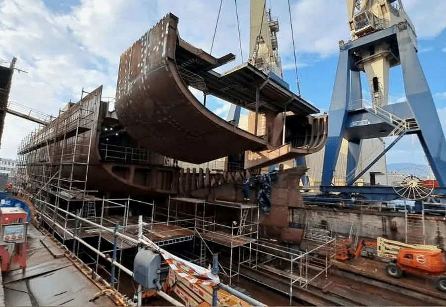 Hull section lifted by crane on the slipway